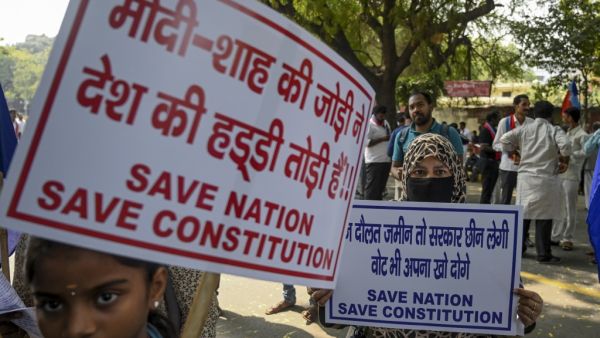 Protesters hold placards during a protest against India's new citizenship law in New Delhi on March 4, 2020. Sajjad HUSSAIN / AFP