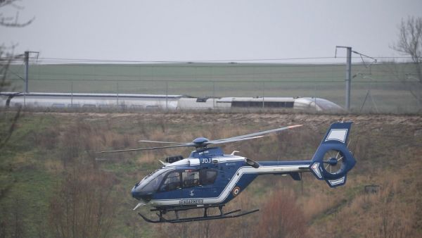 A Gendarmerie helicopter flies near the site where a high-speed TGV train locomotive derailed close to Ingenheim early on March 5, 2020 while travelling from the eastern city of Strasbourg to Paris. "The TGV locomotive went off the tracks near Ingenheim," around 30 kilometres (20 miles) northwest of Strasbourg, an SNCF spokeswoman said. 21 persons have been injured. Patrick HERTZOG / AFP
