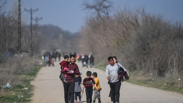 Migrants are on their way to a camp on the Turkish side of the Turkey-Greece border near the Pazarkule crossing gate in Edirne province on March 9, 2020. AFP