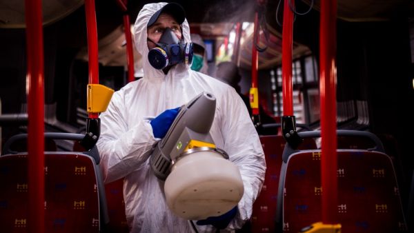 A worker wearing protective clothes disinfects an interior of a public bus in a bus-wash station at Transport Company of Bratislava city as part of precautionary measures against the spread of the new coronavirus COVID-19 in Bratislava, Slovakia on March 11, 2020. Many schools were closed and public events were cancelled due to the coronavirus outbreak in Slovakia as first seven cases of infection were confirmed. VLADIMIR SIMICEK / AFP