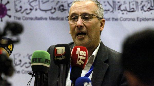 Ahmed al-Hassi, spokesman for the medical committee to combat COVID-19 coronavirus disease in Libya's eastern city of Benghazi, speaks during a press conference on March 20, 2020 announcing updates on figures for suspected cases. Abdullah DOMA / AFP