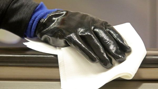 MTA cleaning staff disinfect the 86th St. Q train station on March 4, 2020 in New York City. Six people have been diagnosed with novel coronavirus in the metro New York area, including one community spread infection. Yana Paskova/Getty Images/AFP Yana Paskova / GETTY IMAGES NORTH AMERICA / AFP