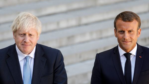 French President Emmanuel Macron and Britain's Prime Minister Boris Johnson speak to the press. (Geoffroy Van der Hasselt/AFP via Getty Images)