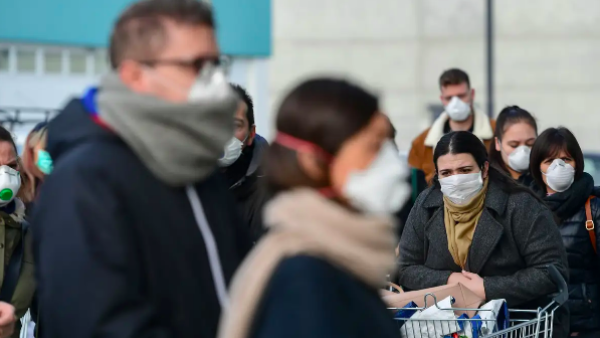 Residents wait to be given access to shop in a supermarket on February 23 in the small Italian town of Casalpusterlengo. Miguel Medina/AFP via Getty Images