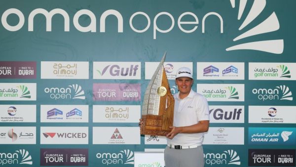 Valimaki with the Oman Open trophy