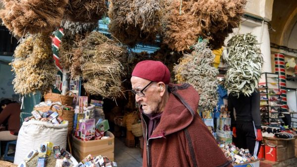 plants at Souk el-Blat, in the Medina (old city) of Tunisia's capital Tunis, on March 14, 2020. The herbalists' district of Souk el-Blat, in the heart of the old city of Tunis, recognisable by its aromatic scents and its stalls where vials, powders and bundles of various plants line up high, is a destination for people searching for traditional recipes against seasonal maladies, but now the attention is on COVID-19 novel coronavirus, for which no scientific remedy is yet known. FETHI BELAID / AFP