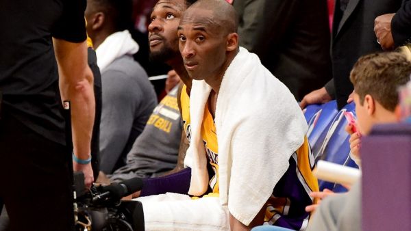 In this file photo Kobe Bryant #24 of the Los Angeles Lakers looks on from the bench late in the fourth quarter against the Utah Jazz at Staples Center on April 13, 2016 in Los Angeles, California. The towel that Kobe Bryant wore over his shoulders during his farewell speech after his final National Basketball League game has fetched over $33,000 at auction, the US media said on March 29, 2020.With the towel draped around him to help mop up his sweat, the Los Angeles Lakers superstar closed his speech with 