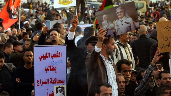 In this file photo taken on February 14, 2020, supporters of Libyan military strongman Khalifa Haftar (image) take part in a demonstration in the coastal city of Benghazi in eastern Libya, against Turkish intervention in the country's affairs. (AFP/File Photo)