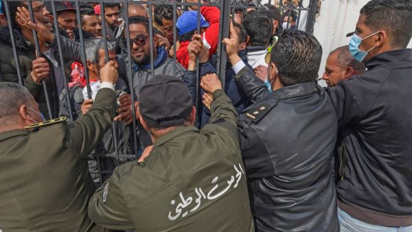 Several hundred Tunisians demonstrated in a working class neighbourhood of Tunis, demanding promised government support and protesting a week-old lockdown against the coronavirus pandemic that has disproportionately impacted the poor. FETHI BELAID / AFP