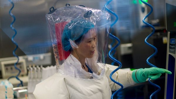 This file photo taken on February 23, 2017 shows a worker inside the P4 laboratory in Wuhan, capital of China's Hubei province. The P4 epidemiological laboratory was built in co-operation with French bio-industrial firm Institut Merieux and the Chinese Academy of Sciences. The facility is among a handful of labs around the world cleared to handle Class 4 pathogens (P4) - dangerous viruses that pose a high risk of person-to-person transmission. JOHANNES EISELE / AFP