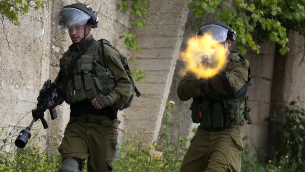 Israeli forces clash with Palestinian demonstrators following a weekly protest against the expropriation of Palestinian land by Israel, in the village of Kfar Qaddum in the Israeli-occupied West Bank, on April 17, 2020. JAAFAR ASHTIYEH / AFP