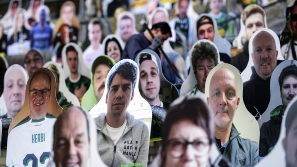 In this file photo taken on April 16, 2020 Cardboard cut-outs with portraits of Borussia Moenchegladbach's supporters are seen at the Borussia Park football stadium in Moenchengladbach, western Germany, amid the novel coronavirus COVID-19 pandemic. German football authorities are set to announce plans on April 23, 2020 for Bundesliga matches to restart on May 9 in empty stadiums, but the potential return in the midst of the coronavirus pandemic is meeting some opposition. Ina FASSBENDER / AFP