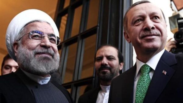 Recep Tayyip Erdogan (L) and Iranian President Hassan Rouhani. (AFP/File)