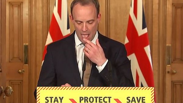 The Foreign Secretary (pictured licking his finger today) was filling in for Boris Johnson as the Prime Minister is self-isolating after testing positive for the deadly bug. (Video Screenshot)