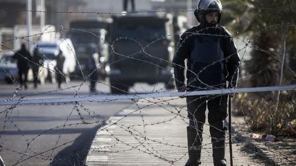 Illustrative photo of Egyptian riot police stand guard in Cairo, January 28, 2014. (AFP/Mahmoud Khaled)