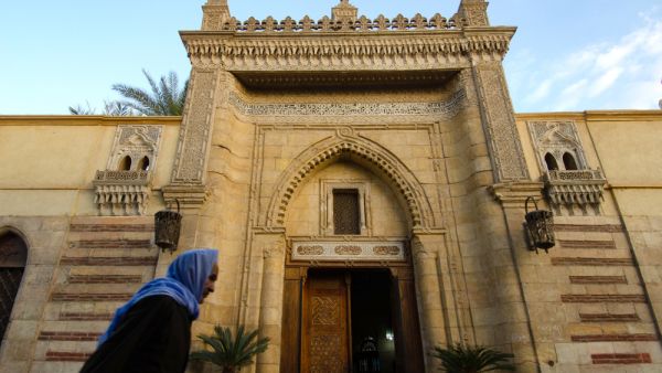 An Old Egyptian Copt walking past the entrance to the Hanging Church of Coptic Cairo, Egypt. (Shutterstock/ File Photo)