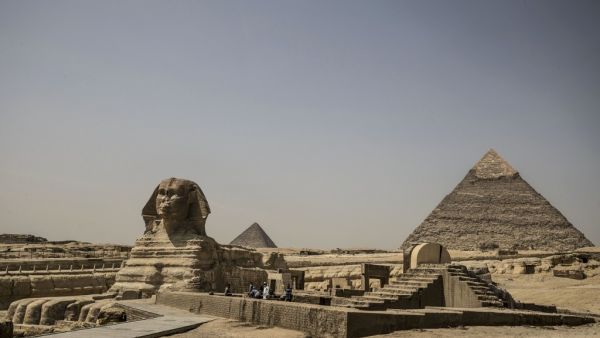 The Giza pyramids necropolis on the southwestern outskirts of the Egyptian capital Cairo is pictured empty on March 25, 2020 after the site closed to the general public as a protective a measure against the spread of the coronavirus COVID-19. Khaled DESOUKI / AFP