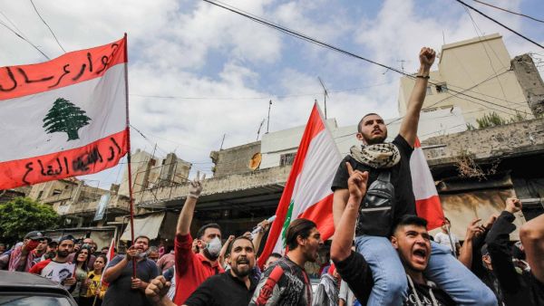 Protesters from across Lebanon gather for a demonstration outside the home of killed protester Fawwaz al-Samman -- who died after he was shot during riots in late April -- in the northern port city of Tripoli on May 3, 2020. Ibrahim CHALHOUB / AFP