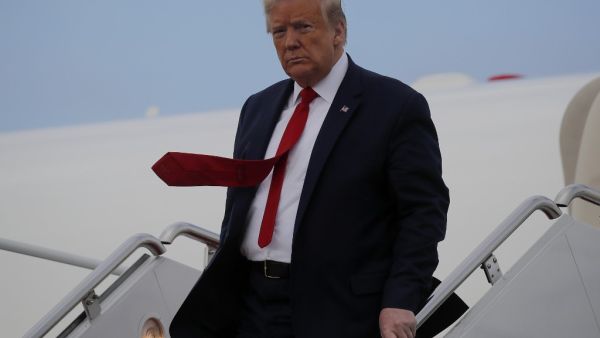 US President Donald Trump steps off Air Force One after returning from travel to Allentown, Pennsylvania during the coronavirus disease (COVID-19) pandemic at Joint Base Andrews, Maryland on May 14, 2020. CARLOS BARRIA / POOL / AFP