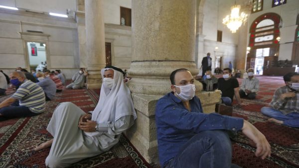 President Bashar al-Assad warned earlier this month of a "catastrophe" in war-battered Syria if the easing of lockdown measures against coronavirus is mishandled.  LOUAI BESHARA / AFP