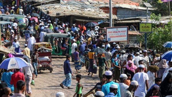 Rohingya refugees gather at a market as first cases of COVID-19 coronavirus have emerged in the area, in Kutupalong refugee camp in Ukhia on May 15, 2020. (AFP/File)