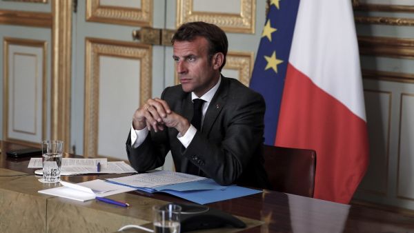 French President Emmanuel Macron listens to German Chancellor during a video conference to discuss a joint plan to spur the EU's recovery from the coronavirus crisis at the Elysee Palace on May 18, 2020, in Paris. (AFP/File)