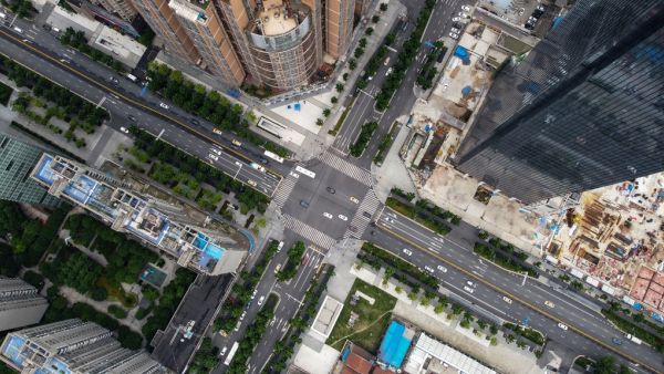 An aerial photo shows buildings and streets in Wuhan, China’s central Hubei province on May 20, 2020. China has largely brought the coronavirus under control within its borders since the outbreak first emerged in the city of Wuhan late last year. Hector RETAMAL / AFP