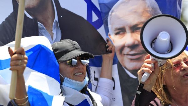 Israeli women shout slogans during a rally in support of Prime Minister Benjamin Netanyahu outside his residence in Jerusalem on May 24, 2020. (AFP/File Photo)