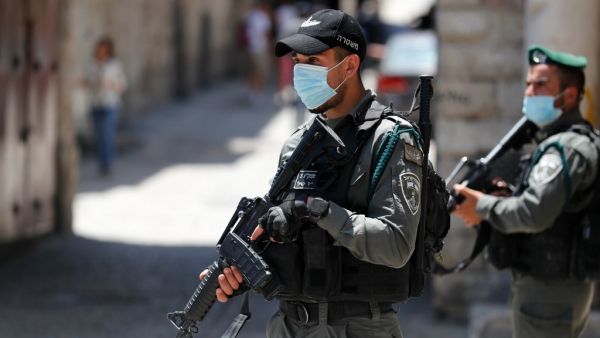 Member of the Israeli security forces patrol in the area where Israeli police in annexed east Jerusalem reportedly shot dead a Palestinian with special needs they mistakenly thought was armed with a pistol, on May 30, 2020. The incident happened in the alleys of the walled Old City near Lions' Gate, an access point mainly used by Palestinians. Ahmad GHARABLI / AFP