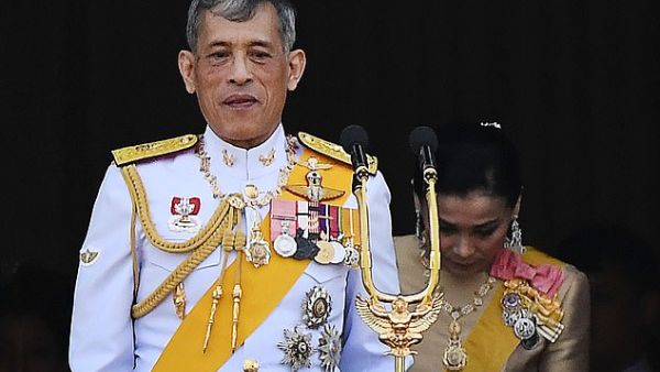 Thailand's King Maha Vajiralongkorn and Queen Suthida appear on the balcony of Suddhaisavarya Prasad Hall of the Grand Palace. (AFP/File)