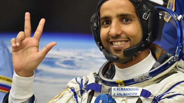United Arab Emirates' astronaut Hazzaa al-Mansoori waves before boarding a Soyuz rocket to the International Space Station (ISS) at the Russian-leased Baikonur cosmodrome in Kazakhstan on 25 September 2019 (AFP)