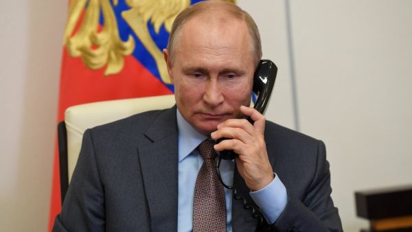 Russian President Vladimir Putin listens to Russian Prime Minister Mikhail Mishustin during their teleconference meeting on Russia's economy recovery at Novo-Ogaryovo state residence, outside Moscow, on June 2, 2020. Russia plans to spend about USD 72 billion (65 billion euro) on a plan to restore the economy following the coronavirus shutdown, Prime Minister Mikhail Mishustin said. Sputnik / AFP