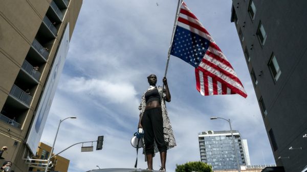 A protesters takes a moment while speaking to the crowd as they march through Hollywood during a demonstration over the death of George Floyd while in Minneapolis Police custody, in Los Angeles, California, June 2, 2020. Anti-racism protests have put several US cities under curfew to suppress rioting, following the death of George Floyd in police custody. Kyle Grillot / AFP