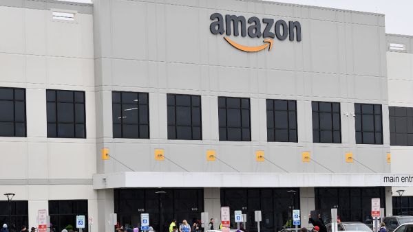 In this file photo taken on March 30, 2020, Amazon workers at Amazon's Staten Island warehouse strike in demand that the facility be shut down and cleaned after one staffer tested positive for the coronavirus in New York. (AFP/File)