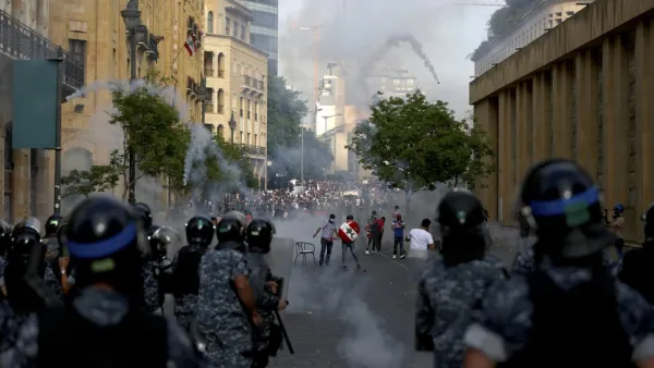 Lebanese riot police fire tear gas at protesters in central Beirut on June 6, 2020. Protesters poured into the streets of the Lebanese capital to decry the collapse of the economy, as clashes erupted between supporters and opponents of the Iran-backed Shiite group Hezbollah. PATRICK BAZ / AFP