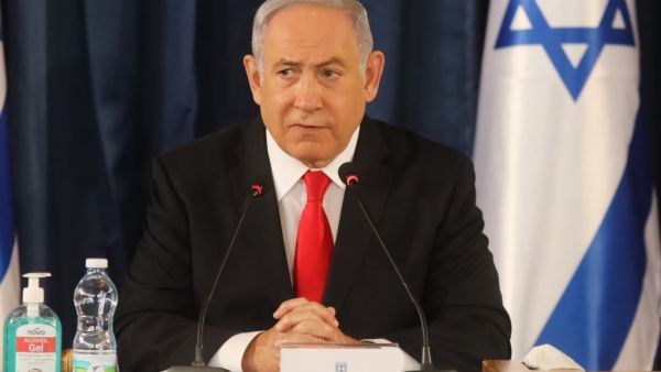 Israeli Prime Minister Benjamin Netanyahu chairs the weekly cabinet meeting in Jerusalem on June 7, 2020. Netanyahu urged world powers to reimpose tough sanctions against Iran, vowing to curb Tehran's regional "aggression" hours after another deadly strike on pro-Iranian fighters in Syria. Menahem KAHANA / AFP