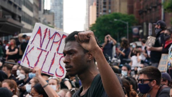 Protesters sit in the middle of 42nd Street near Times Square over the death of George Floyd by a Minneapolis police officer on June 7, 2020 in New York. Bryan R. Smith / AFP