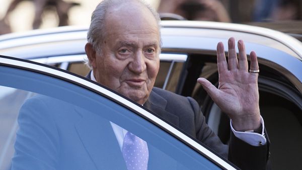In this file photo taken on April 1, 2018 former King Juan Carlos I of Spain waves as he leaves after attending the traditional Easter Sunday Mass of Resurrection in Palma de Mallorca. The Spanish Supreme Court announced on June 8, 2020 the opening of an investigation to establish whether former King Juan Carlos has criminal responsibility in an alleged corruption case when Saudi Arabia entrusted the construction of the Mecca TGV to a Spanish consortium. JAIME REINA / AFP