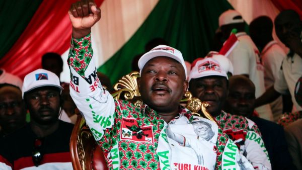 In this file photo taken on May 16, 2020 Burundi’s incumbent president Pierre Nkurunziza raises his fist as he reacts to supporters during the last campaign rally of the candidate of the ruling party the National Council for the Defense of Democracy - Forces for the Defense of Democracy (CNDD-FDD), in Bujumbura. (AFP/File)