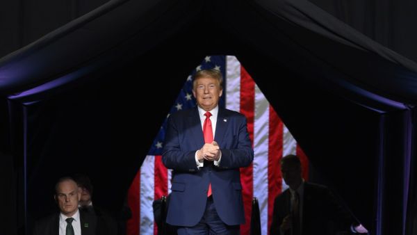 In this file photo taken on February 19, 2020 US President Donald Trump arrives to deliver remarks at a Keep America Great rally in Phoenix, Arizona. Donald Trump has postponed a controversial rally scheduled for the same day as a holiday commemorating the end of slavery in the US, following fierce criticism, he announced June 12. The "Make America Great Again" rally in Tulsa, Oklahoma had been due to mark Trump's return to the campaign trail, but he said on Twitter the event had been postponed "out of resp