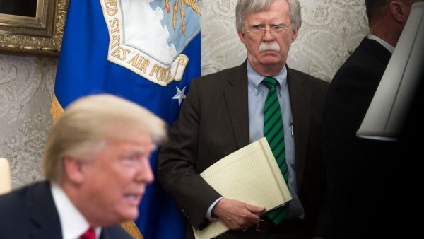 In this file photo National Security Adviser John Bolton stands alongside US President Donald Trump as he speaks during a meeting with NATO Secretary General Jens Stoltenberg in the Oval Office of the White House in Washington, DC, May 17, 2018. SAUL LOEB / AFP