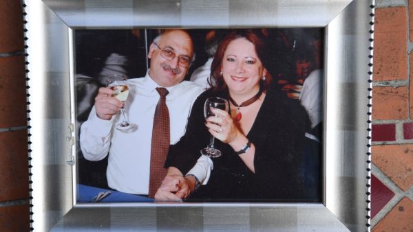 A picture shows a family photograph of Anoosheh Ashoori (L) and wife Sherry Izadi (R), seen during an interview with AFP in London on June 19, 2020. The sound is a little fuzzy but Anoosheh Ashoori's voice does not falter as he delivers his message to British Prime Minister Boris Johnson from inside Iran's Evin jail. DANIEL LEAL-OLIVAS / AFP