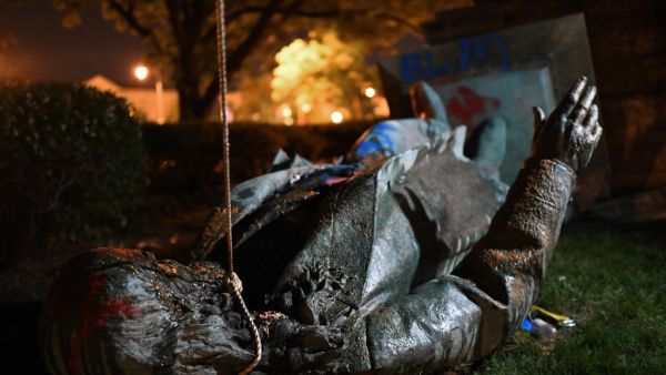 The statue of Confederate general Albert Pike is pictured after it was toppled by protesters at Judiciary square in Wahsington, DC on late June 19, 2020. Protesters have toppled the only statue of a Confederate general in the US capital, images broadcast by US media show. President Donald Trump tweeted that the Washington "D.C. police are not doing their job as they watch a statue be ripped down & burn. These people should be immediately arrested. A disgrace to our Country!" The images, broadcast on ABC7 Ne