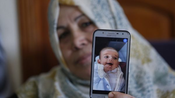 Baby Omar Yaghi was eight months old when he died, unable to travel from Gaza to Israel for life-saving heart surgery after Palestinian officials cut coordination. Yaghi was born with complex heart problems and he started treatment at Israel's Sheba Medical Center when he was just one month old. (MOHAMMED ABED / AFP)