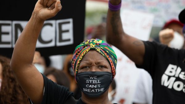 A woman raises her fist as protesters gathered for the March On Georgia, organized by NAACP, on June 15, 2020 in Downtown Atlanta, Georgia. The march comes in response to the police killing of Rayshard Brooks outside an Atlanta Wendy's restaurant on June 12. Dustin Chambers/Getty Images/AFP