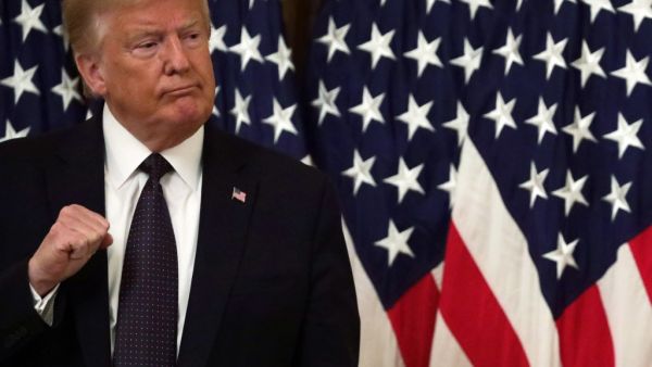 U.S. President Donald Trump gestures during an East Room event to announce the PREVENTS Task Force at the White House June 17, 2020 in Washington, DC. President Trump held the event to announce plans to prevent suicides among U.S. military veterans. Alex Wong/Getty Images/AFP