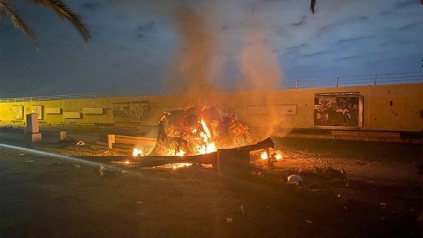 A picture published by the media office of the Iraqi military's joint operations forces on their official Facebook page shows a destroyed vehicle on fire following a US strike on January 3, 2020 on Baghdad international airport road. (File/AFP)