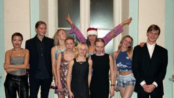 Ekaterina and Maria Putina (pictured in the centre) surrounded by members of Russian pop group Strelki in the early 2000s (Twitter)