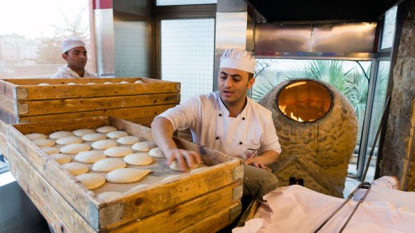 Traditional bread making activity for a commercial food chain in Jordan (Shutterstock)