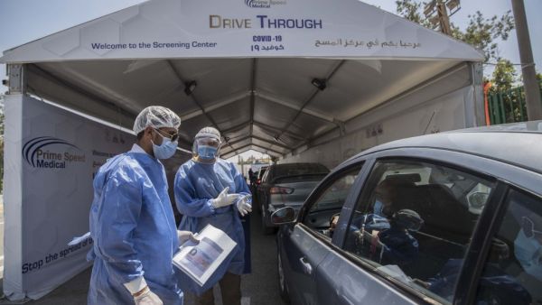 Egyptian health workers collect samples at a drive-through coronavirus-testing center at the Ain Shams University in Cairo on June 29, 2020. Egypt has so far registered 65,188 COVID-19 cases including 2,789 fatalities. Khaled DESOUKI / AFP